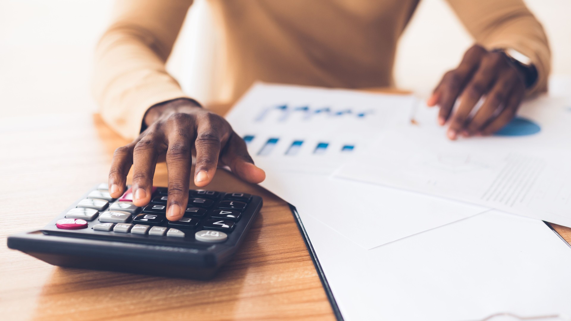 African american accountant calculating budget of the company